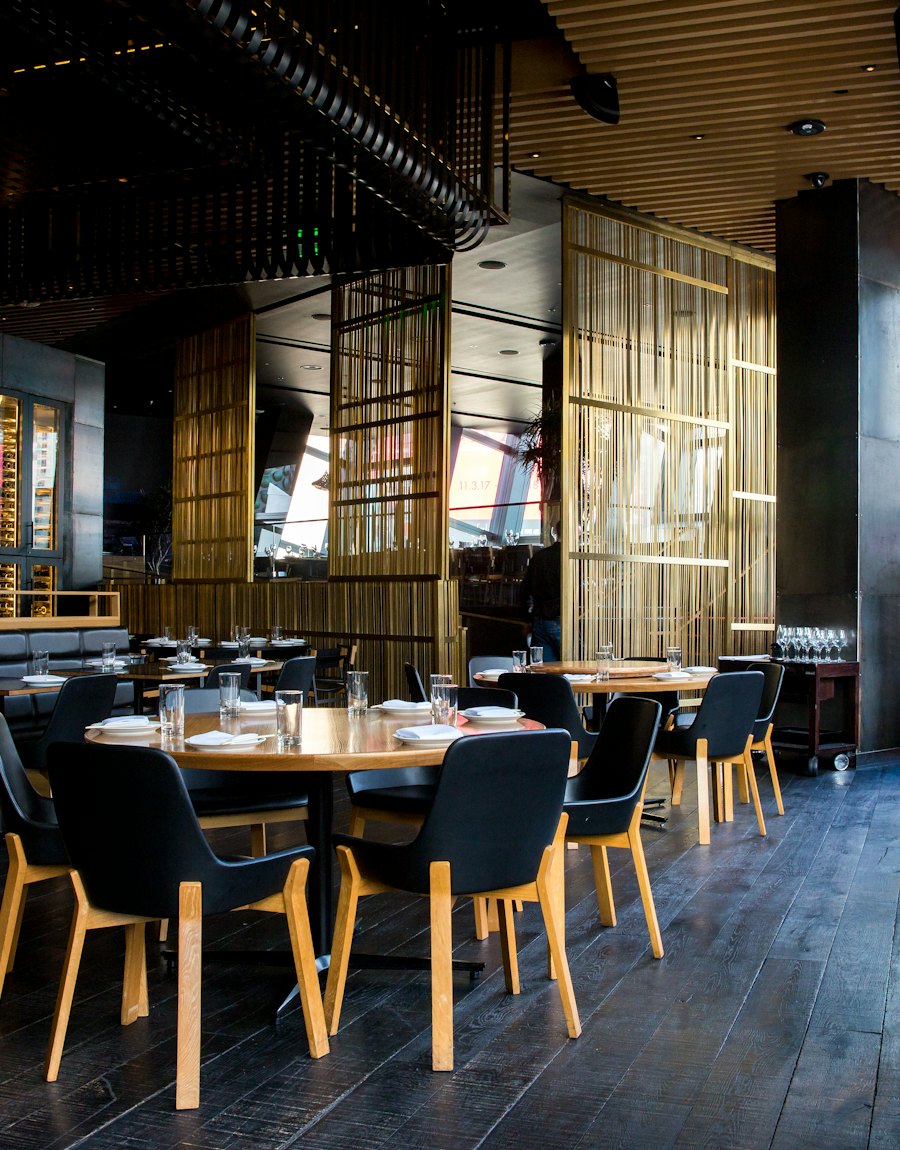 Dark wood tables and banquettes
